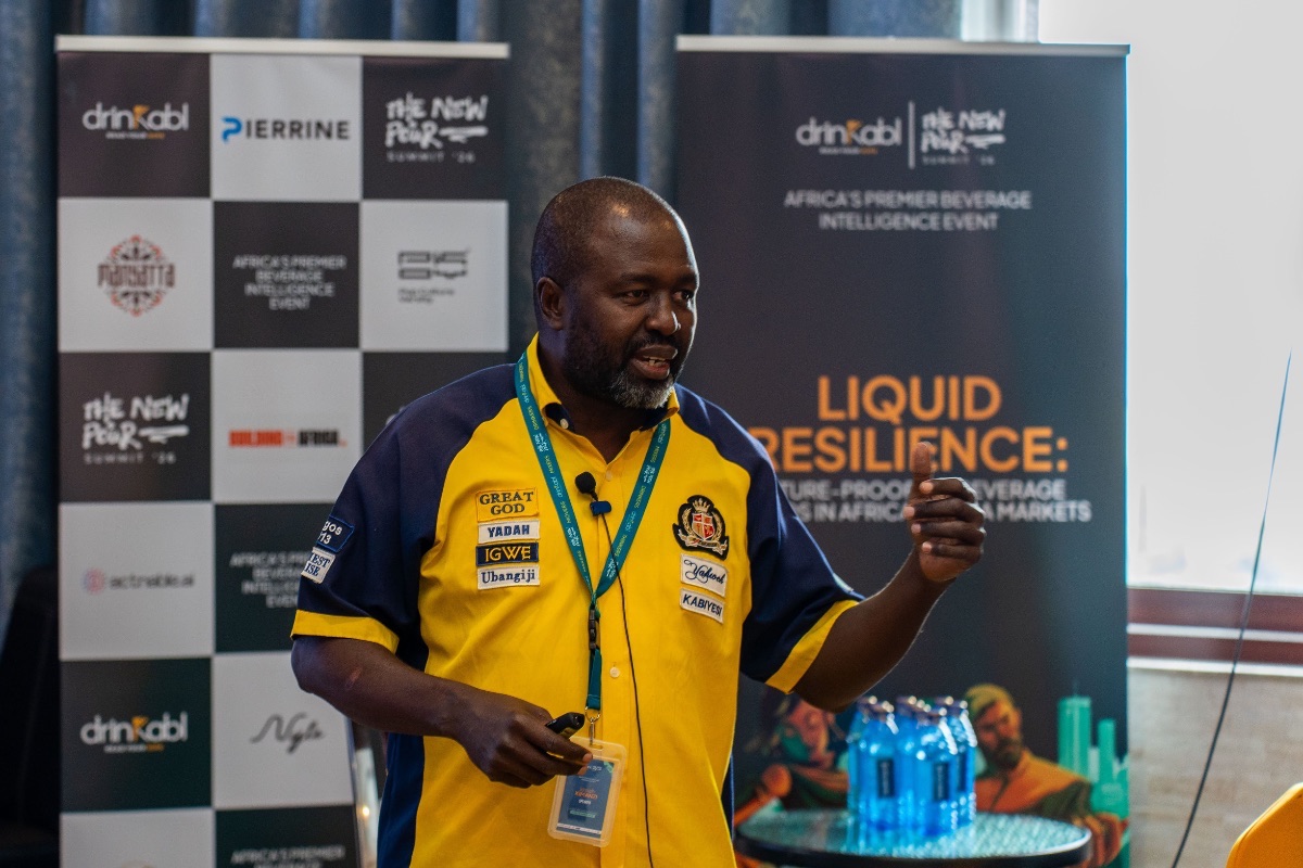 Speaker presenting in front of the partner banner wall