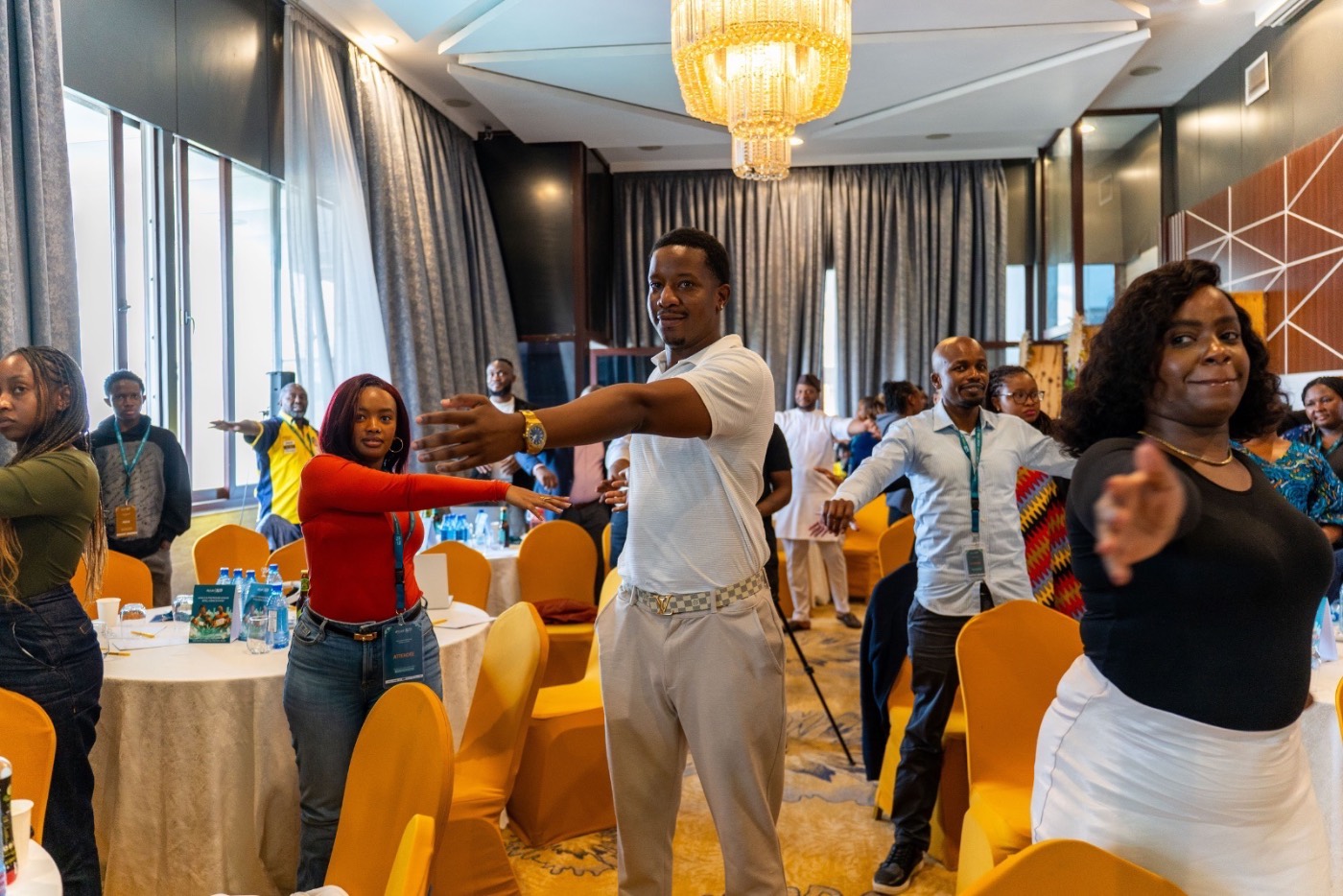 The full room on its feet during a session activity